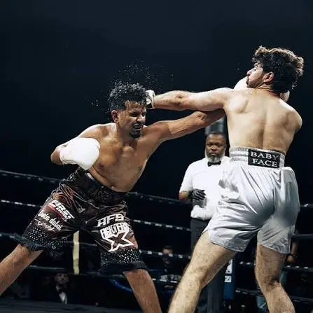 Rashed Belhasa exchanging punches with an opponent mid-fight