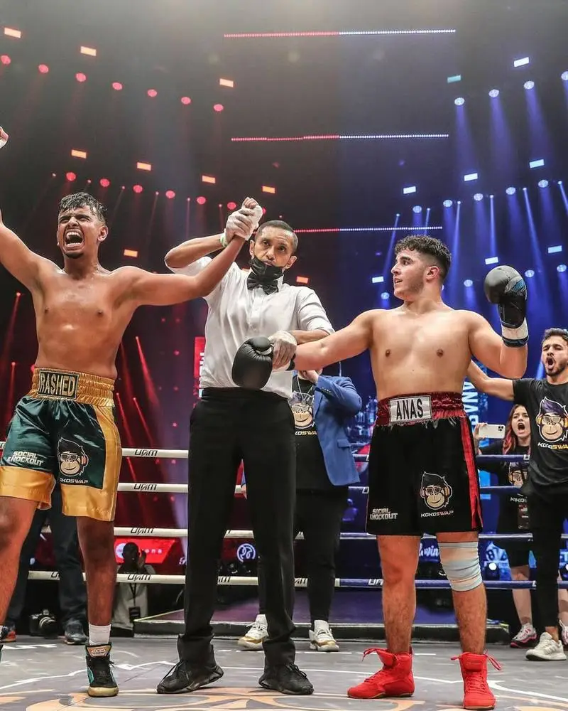 Rashed Belhasa celebrating his boxing win with his hand raised in the ring